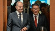 German Chancellor Olaf Scholz (L) and China's Premier Li Qiang enter the conference room to attend German-Chinese economy consultations on June 20, 2023 at the Chancellery in Berlin.
Photo by Tobias SCHWARZ / AFP