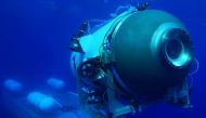 This undated image courtesy of OceanGate Expeditions, shows their Titan submersible launching from a platform. (Photo by Handout / OceanGate Expeditions / AFP)

