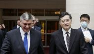 This handout picture taken and released by the Ministry of Foreign Affairs of the People's Republic of China on June 25, 2023 shows Russia's deputy foreign minister Andrey Rudenko (L) and China's Foreign Minister Qin Gang (R) walk together as they meet in Beijing. (Photo by Handout / Ministry of Foreign Affairs of the People's Republic of China / AFP)