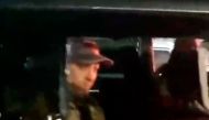 This video grab taken from handout footage posted late on June 24, 2023 on the Telegram channel @rstv01 shows Yevgeny Prigozhin looking on from a car as he leaves the headquarters of the Russian southern military district in the city of Rostov-on-Don. Wagner mercenaries were headed back to base on June 25, 2023, after Russia's President Vladimir Putin agreed to allow their leader to avoid treason charges and accept exile in Belarus. (Photo by Handout / TELEGRAM / @rstv01 / AFP)
