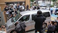 A vehicle believed to carry Japanese Kabuki actor Ennosuke Ichikawa enters the Metropolitan Police Department Meguro Police Station in Tokyo on June 27, 2023. (Photo by JIJI Press / AFP)