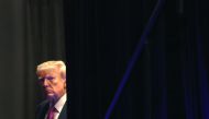 Former U.S. President Donald Trump waits to be introduced at the Oakland County Republican Party's Lincoln Day dinner at Suburban Collection Showplace on June 25, 2023 in Novi, Michigan. (Photo by SCOTT OLSON / GETTY IMAGES NORTH AMERICA / Getty Images via AFP)