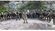 This video grab taken from a handout footage posted on May 5, 2023 on the Telegram account of the press-service of Concord -- a company linked to the chief of Russian mercenary group Wagner, Yevgeny Prigozhin -- shows Yevgeny Prigozhin addressing the Russian army's top brass standing in front of Wagner fighters at an undisclosed location. (Photo by Handout / TELEGRAM/ @concordgroup_official / AFP)