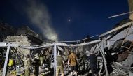 Rescuers and volunteers work to rescue people from under the rubble after Russian missile strike hit a restaurant and several houses in Kramatorsk, eastern Ukraine, on June 27, 2023. (Photo by Genya SAVILOV / AFP)
