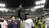 Domingo German #0 of the New York Yankees celebrates his no-hit perfect game against the Oakland Athletics, defeating them 11-0 at RingCentral Coliseum on June 28, 2023 in Oakland, California. (Photo by Thearon W. Henderson / GETTY IMAGES NORTH AMERICA / Getty Images via AFP)