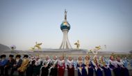 People gather for the ceremony inaugurating the new city of Arkadag - named in honour of Turkmenistan's former leader Gurbanguly Berdymukhamedov - in Arkadag, some 30 kilometres outside the capital Ashgabat, on June 29, 2023. (Photo by Natalia Kolesnikova / AFP)