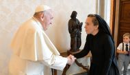 This handout photo taken and released on 30 June 2023, by The Vatican Media shows Pope Francis (L) shaking hands with Stella Assange, wife of WikiLeaks founder Julian Assange, during a private audience in the Vatican. (Photo by Handout / VATICAN MEDIA / AFP)