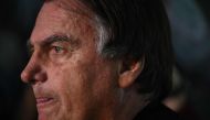 Former Brazilian President Jair Bolsonaro gestures as he speaks to members of the media upon arrival at the Santos Dumont Airport in Rio de Janeiro, Brazil, on June 29, 2023. (Photo by MAURO PIMENTEL / AFP)
