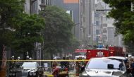 Firefighters gather at the fire scene in the Shinbashi area of Tokyo on July 3, 2023.  Photo by Kazuhiro NOGI / AFP
