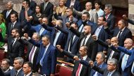 Members of Greek nationalist party Spartiates and Greek far-right party Niki (Victory) attend a swear in ceremony of the parliament in Athens on July 3, 2023, following the general elections. Greek parliament convened for its first session after the June 25 on July 3, 2023. (Photo by Aris MESSINIS / AFP)
