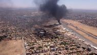 File photo: This image grab taken from AFPTV video footage on April 20, 2023, shows an aerial view of black smoke rising above the Khartoum International Airport amid ongoing battles between the forces of two rival generals. (Photo by AFP)

