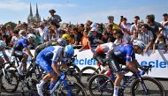 :Alpecin-Deceuninck's Belgian rider Jasper Philipsen (R) sprints ahead of Cofidis' German rider Simon Geschke (2nd R) and Team Jayco Alula's Slovenian rider Luka Mezgec (C) to the finish line to win the 3rd stage of the 110th edition of the Tour de France cycling race, 193,5 km between Amorebieta-Etxano in Northern Spain and Bayonne in southwestern France, on July 3, 2023. (Photo by Marco BERTORELLO / AFP)