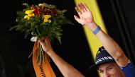 Alpecin-Deceuninck's Belgian rider Jasper Philipsen celebrates his victory on the podium after winning the 4th stage of the 110th edition of the Tour de France cycling race, 182 km between Dax and Nogaro, in southwestern France, on July 4, 2023. (Photo by Anne-Christine POUJOULAT / AFP)
