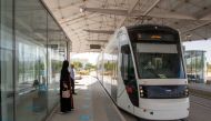Passengers waiting to board a tram at Education City.