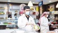 Inspectors carrying out inspection at a food outlet in Al Wakra Municipality.