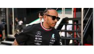Mercedes' British driver Lewis Hamilton arrives for the first practice session ahead of the Formula One British Grand Prix at the Silverstone motor racing circuit in Silverstone, central England on July 7, 2023. (Photo by ANDREJ ISAKOVIC / AFP)