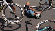Astana Qazaqstan Team's British rider Mark Cavendish lies on the ground after suffering a crash during the 8th stage of the 110th edition of the Tour de France cycling race, 201 km between Libourne and Limoges, in central western France, on July 8, 2023. (Photo by Thomas SAMSON / AFP)
