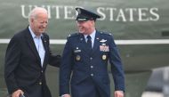 US President Joe Biden speaks with Colonel W Chris McDonald, Commander, Dover Air Force Base, as he walks to board Air Force One at Dover Air Force Base in Dover, Delaware, on July 9, 2023. (Photo by ANDREW CABALLERO-REYNOLDS / AFP)