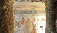 This handout photograph released by the CEA ULiege on July 12, 2023 shows studio lights illuminating a mural of the tomb of Menna, in Sheikh Abd el Qurnah, near Luxor in Egypt, on January 8, 2018. (Photo by Handout / CEA ULIEGE / AFP)