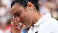 Second-placed Tunisia's Ons Jabeur cries after receiving her prize during the ceremony following her defeat in the women's singles final tennis match against Czech Republic's Marketa Vondrousova on the thirteenth day of the 2023 Wimbledon Championships at The All England Lawn Tennis Club in Wimbledon, southwest London, on July 15, 2023. (Photo by SEBASTIEN BOZON / AFP)