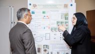 A student explaining her project during the research retreat event. 