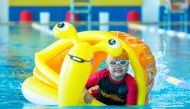 A child taking swiming lessons as part of QF’s Ability Friendly Summer Camp