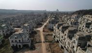 This aerial photo taken on March 31, 2023 shows the view of deserted villas in a suburb of Shenyang in China's northeastern Liaoning province. (Photo by Jade Gao / AFP) 
