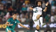 Al Sadd’s Akram Afif (right) in action during friendly against Raja Club Athletic yesterday. 