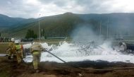 This handout picture released by the Russian emergency situations ministry shows the ministry's personnel working at the site of a helicopter crash in the southern Siberian region of Altai on July 27, 2023. Photo by Handout / Russian Emergencies Ministry / AFP