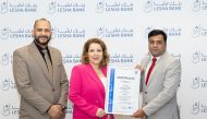 Lesha bank CRO Fulya Plas and Head of Corporate Services Ahmed Abou Elela receives the ISO certification from Mr. Manadar Pagare (Business Manager- TÜV SÜD)
