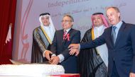 Minister of Communications and Information Technology H E Mohamed bin Ali Al Mannai (first left) and Ambassador of Peru to Qatar H E Jose A Benzaquen Perea (second left) along with other dignitaries cutting the ceremonial cake at the reception held to mark  202nd Anniversary of National Independence of Peru.