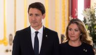 (FILES) Prime Minister of Canada Justin Trudeau (L) and his wife Sophie Trudeau (R) arrive to sign a book of condolence at Lancaster House, in London in London on September 17, 2022 following the death of Queen Elizabeth II on September 8. (Photo by David PARRY / AFP)

