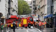 A firefighter vehicle leaves the area after a building collapsed due to an explosion on Rue Du Nord, in the 18th distrcit of Paris, on August 5, 2023. At least five people were injured in an explosion in a flat in the north of Paris. (Photo by Bertrand GUAY / AFP)
