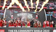 Arsenal's Norwegian midfielder Martin Odegaard holds up the trophy as Arsenal players celebrate winning the English FA Community Shield football match between Arsenal and Manchester City at Wembley Stadium, in London, August 6, 2023. (Photo by Glyn KIRK / AFP) / NOT FOR MARKETING OR ADVERTISING USE / RESTRICTED TO EDITORIAL USE
