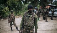 A Democratic Republic of Congo soldier is seen on patrol in the village of Manzalaho, near Beni, on February 18, 2020, following an alleged attack by members of the Allied Democratic Forces (ADF) rebel group. File photo / AFP

