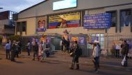 People gather outside the building where Ecuadorian presidential cadidate Fernando Villavicencio held a rally after shots were fired in Quito, on August 9, 2023. (Photo by AFP)
