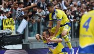File photo: Juventus' Leonardo Bonucci celebrates scoring their first goal with Alvaro Morata. REUTERS/Massimo Pinca.

