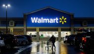 A shopper pushes a cart through the parking lot of a Walmart on the morning of Black Friday in Wilmington, Delaware, on November 25, 2022. Photo by Samuel Corum / AFP