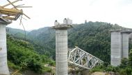 Rescue workers conduct a search operation at the site of an accident where an under-construction railway bridge collapsed in Sairang town of the Aizwal district in India's eastern state of Mizoram on August 23, 2023. (Photo by AFP)