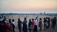 Voters queue to cast their ballots at a polling station in Bulawayo on August 23, 2023. (Photo by Zinyange Auntony / AFP)
