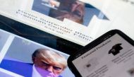 This photo illustration created in Washington, DC, on August 27, 2023, shows the mugshot of former US President Donald Trump next to a website called Trump Save America JFC, a joint fundraising committee on behalf of Donald J. Trump for President 2024, which is selling merchandise bearing his mugshot. (Photo by Stefani Reynolds / AFP)