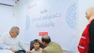 A child receives treatment under QRCS health project in Yemen. 
