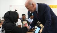 US President Joe Biden speaks with students as he and US First Lady Jill Biden welcome students back to school while visiting Eliot-Hine Middle School in Washington, DC, on August 28, 2023. (Photo by Saul Loeb / AFP)