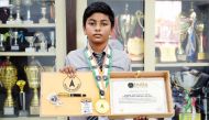 Vedant Suresh with his award.
