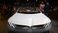 Visitors take pictures of a study of the 'Neue Klasse' (New Class) project, the new electric vehicle concepts, is seen during a preview event in Munich on September 2, 2023, on the eve of the opening of the Munich Motor Show (IAA) on September 4, 2023. (Photo by Tobias SCHWARZ / AFP)
