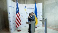 Ukraine's Foreign Minister Dmytro Kuleba (right) and US Secretary of State Antony Blinken embrace at the end of their joint press conference at the Ministry of Foreign Affairs in Kyiv on September 6, 2023. (Photo by Brendan Smialowski / POOL / AFP)