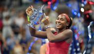 USA's Coco Gauff poses with the trophy after defeating Belarus's Aryna Sabalenka in the US Open tennis tournament women's singles final match at the USTA Billie Jean King National Tennis Center in New York on September 9, 2023. (Photo by ANGELA WEISS / AFP)