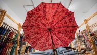 This photo taken on August 3, 2023 shows umbrellas on display at Komiya Shoten at the Higashi-Nihombashi area of Tokyo. (Photo by Richard A. Brooks / AFP) 