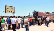 File photo: African migrants wait for a train at the railway station on July 5, 2023, as they flee to Tunis amid unrest in Sfax following the stabbing on July 3 of a Tunisian man in an altercation with migrants. (Photo by HOUSSEM ZOUARI / AFP)
