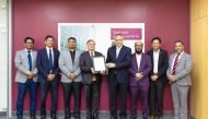 Qatar Airways officials with the IT Service Management System excellence certification.